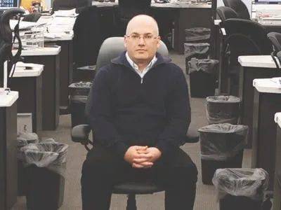 Steve Cohen sitting in a chair