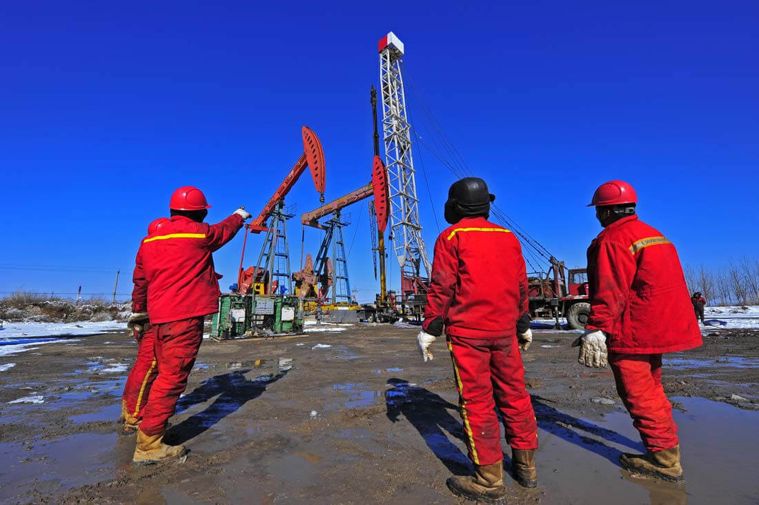 workers doing oil operations