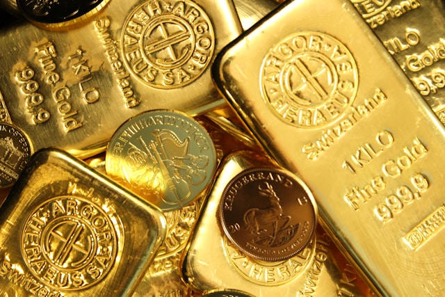 Lingotes de oro brillantes, símbolo de valor y refugio seguro en inversiones financieras