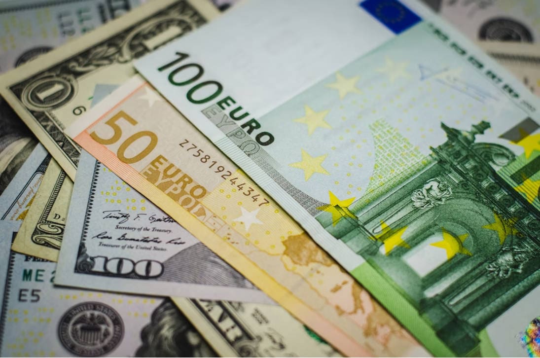 A pile of money sitting on top of each other