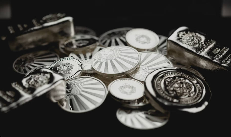 Stack of silver coins, rounds, and bullion bars