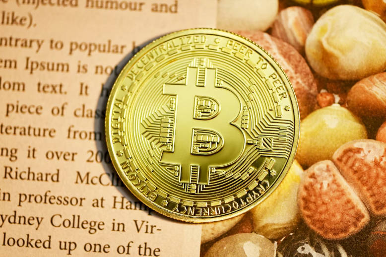 A Bitcoin on white paper