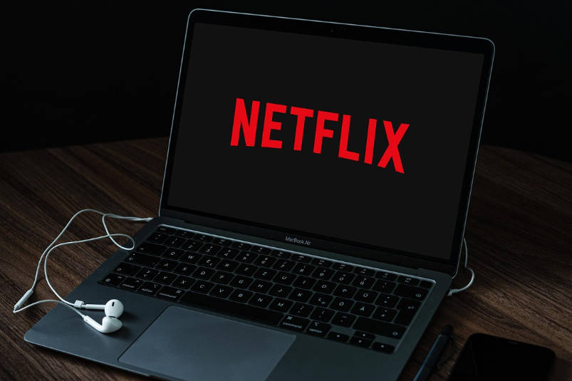 A turned-on laptop showing Netflix