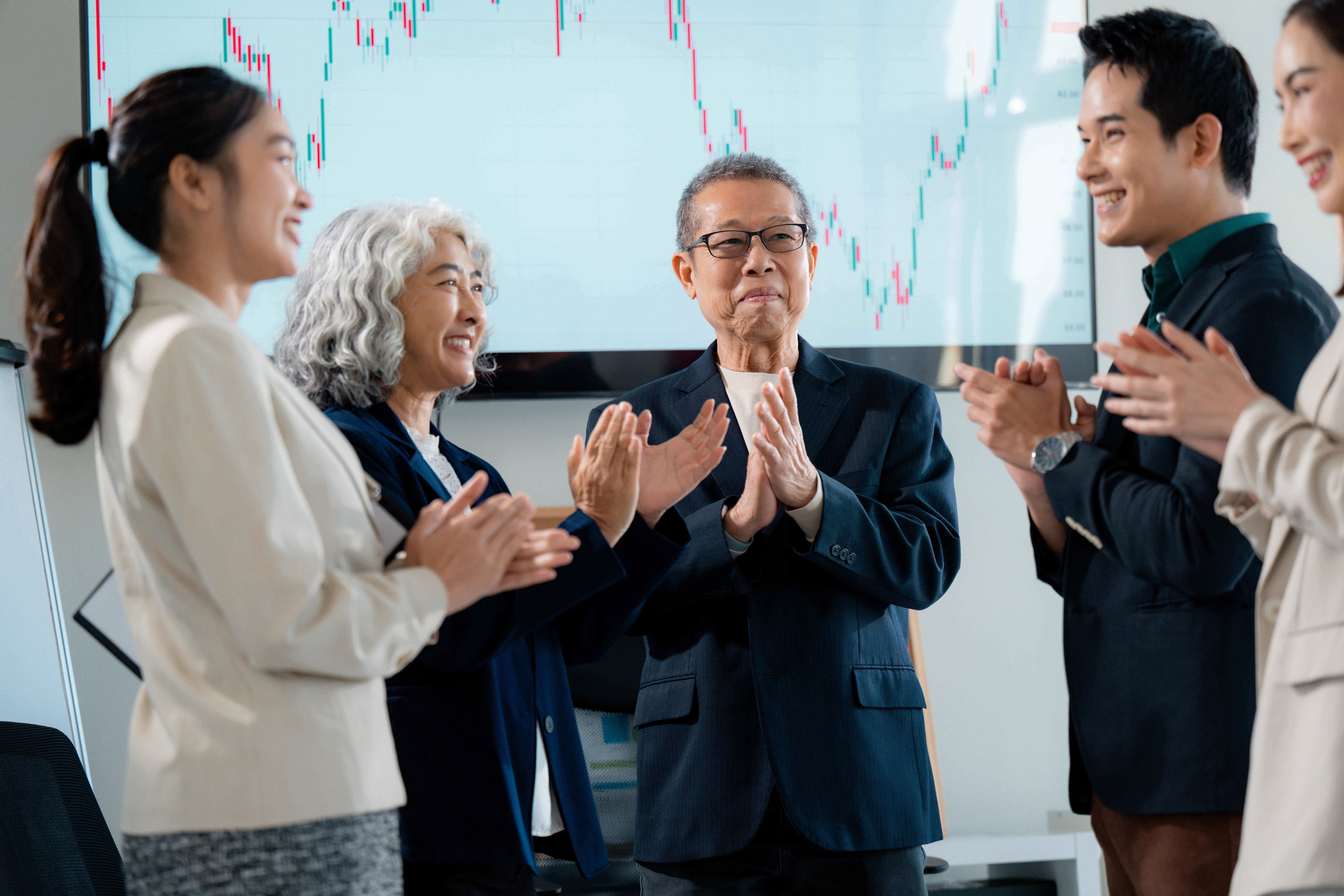 Colleagues Applauding Financial Achievement Apr 22 2025 (1).jpeg