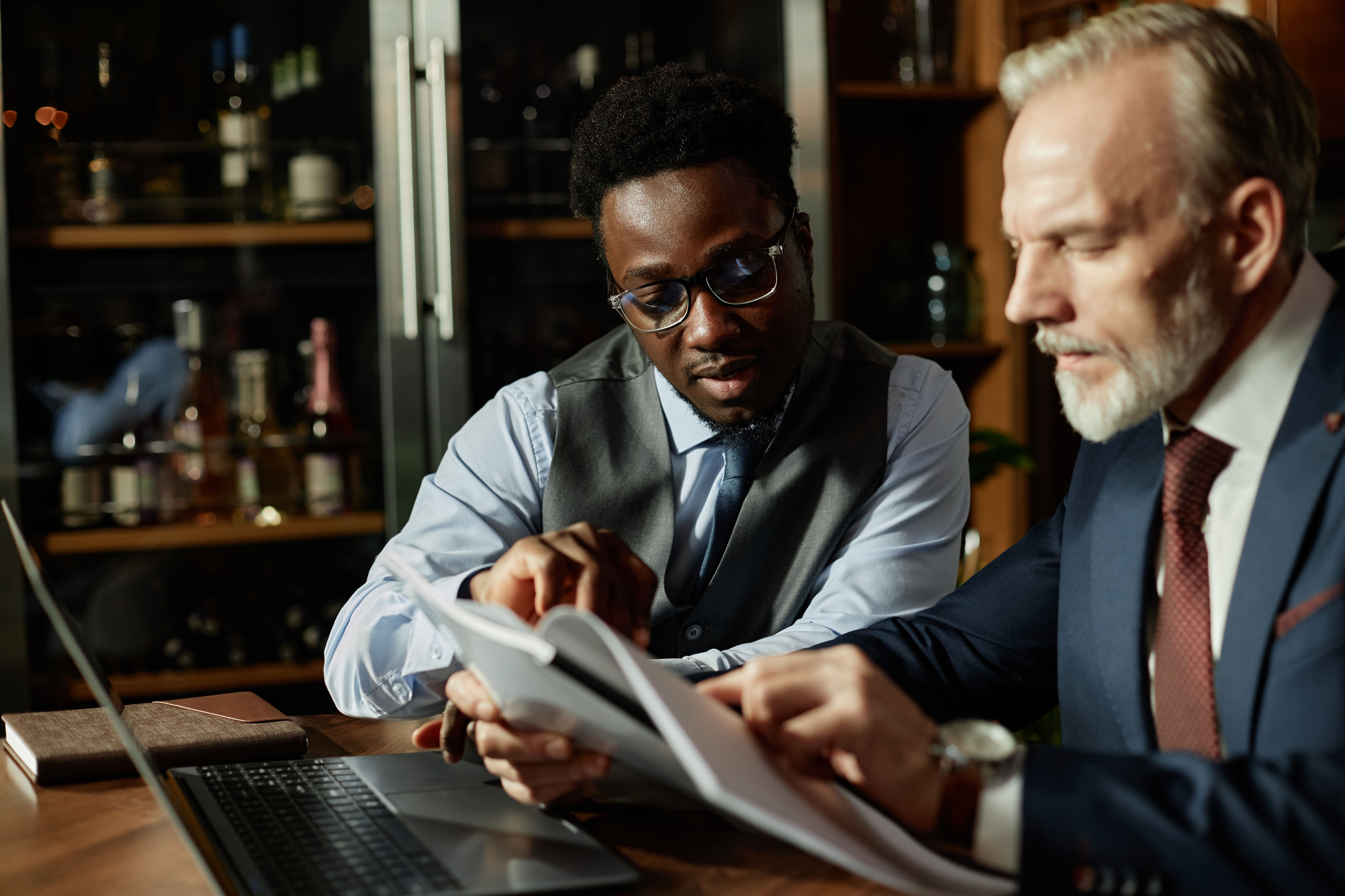 Colleagues Examining Contract Jan 8 2026.jpeg