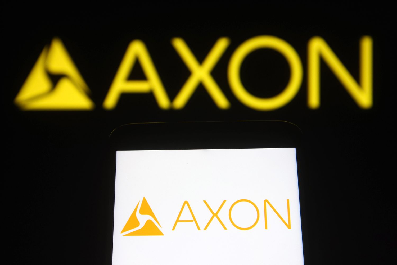 Акции AXON